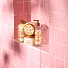 Foaming gel body wash bottles on shelf, Coco Colada scent, pump bottles and jar