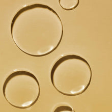 Tree Hut Coco Colada moisturizing shave oil texture with glossy circular droplets