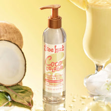 Tree Hut Coco Colada moisturizing shave oil with coconut and a glass