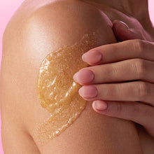Golden Vanilla shea sugar scrub applied to skin, hand rubbing