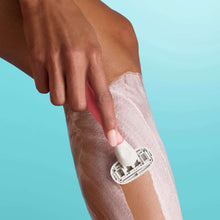 Whipped shave butter being applied on an arm by hand