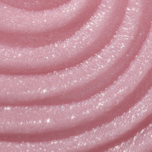 Close-up of pink shea sugar scrub texture