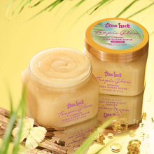 Tree Hut Tropic Glow sugar scrub jar with open cream scoop, golden beige texture