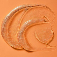 Shimmering gel body wash swirl with sparkling golden texture
