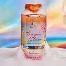 Tropic Glow sparkling gel wash bottle with orange cap, 18 fl oz, in snowy foam