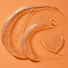 Foaming body wash gel swirl with golden sparkling texture in a scoop shape