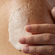 Shea sugar scrub paste spread on skin with fingers