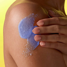 Violet Victory shea sugar body scrub spread on skin, glittery blue texture