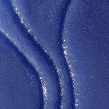 Violet Victory shea sugar body scrub, glittery blue textured surface close-up