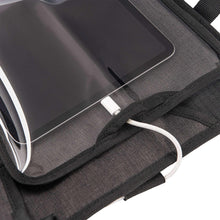Back seat organizer strap with white cords and stitched edges on dark gray fabric