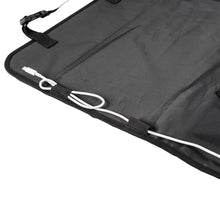 Back seat organizer cover with elastic straps and white cords, flat lay