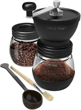 Black manual coffee grinder kit with coffee beans jar, scoop, and brush