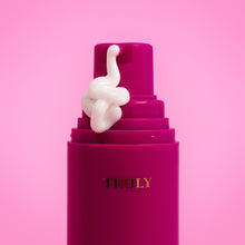 Shave cream pump with dollop of pale gel on top nozzle