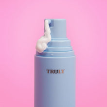 Shave cream canister with nozzle, light blue bottle and white cream swirl