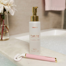 Vanilla Baby shave oil bottle with gold pump and pink handle razor