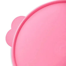 Pink meal prep container lid and base, shown in close-up
