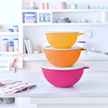 Stacked orange and purple Thatsa bowls with lids