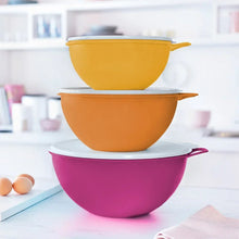 Orange and purple Thatsa bowl set with stacked bowls and lids