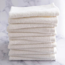 Washcloth set with white terry towels stacked