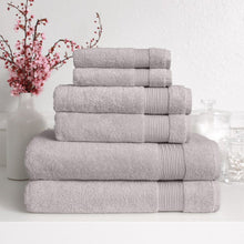 Light grey Turkish towel set with four folded towels stacked with ribbed trim