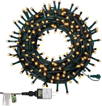 Green wire Christmas light strand with small warm white bulbs in a loop