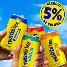 Six hard iced tea cans in hands with “Alcohol 5% by volume” label visible