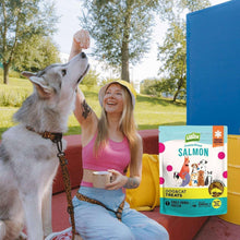 Freeze-dried salmon pet treats pouch with small dog and smiling person outdoors