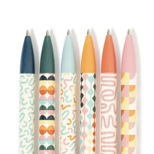 Six capped ballpoint pens with patterned barrels in dark and light colors