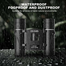 Black binoculars with splash and rain droplets, waterproof and dustproof style design.