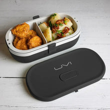 Self-heating lunch box with UV light sanitizer, black, open with divider and food inside