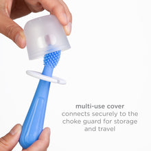 Blue silicone training toothbrush with a clear protective cover for storage and travel