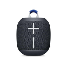 Black wireless Bluetooth speaker with blue carry handle and white cross control icon