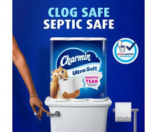 Charmin Ultra Soft toilet paper roll beside toilet, clog-safe and septic-safe
