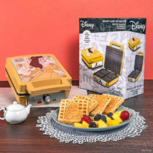 Waffle maker with Belle waffle plate, with fruit-topped waffles on a serving plate