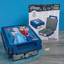 Disney Frozen waffle maker with open lid, plus boxed waffle maker parts