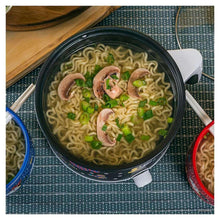 Ramen noodles in Mickey Mouse hot pot with mushrooms and green peas