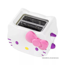 White toaster with open top slots and pink bow front detail