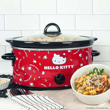 Hello Kitty 5-qt slow cooker with red body and black lid, with serving bowl nearby