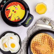 Pikachu waffle maker with cooked waffles shaped like Pikachu on grid patterns