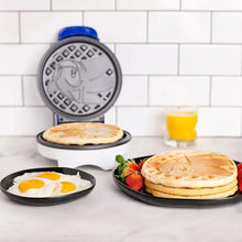 Round waffle maker with open lid, gray pattern and Sonic-shaped waffles