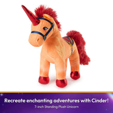 Orange standing plush unicorn with red mane, horn, and blue bridle