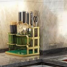 Green two-compartment utensil holder with slots for kitchen tools, countertop organizer