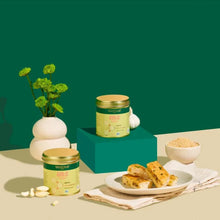 Garlic powder jars with gold lids, bowl of granulated garlic, and a dish of pieces