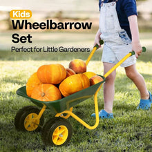 Kids wheelbarrow set with green bin, yellow handles, and yellow wheelbase holding pumpkins