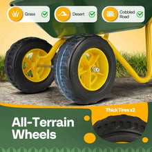 All-terrain wheel close-up on kids wheelbarrow: black tires with yellow rims and hubs