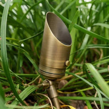 Brass low-voltage outdoor LED spotlight with spike stake and angled light head