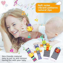Baby foot and wrist rattles with colorful character faces on striped fabric