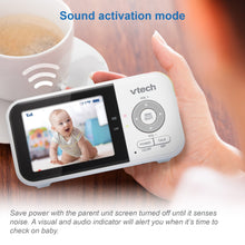 VTech digital video baby monitor parent unit in hand with live baby video screen