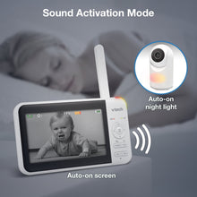 Baby video monitor screen showing a baby, with pan-tilt camera and night light