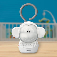 Baby monkey sleep soother on tabletop with ring handle and rounded ears